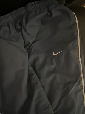 Vintage Lined Nike Men's Dark Blue Joggers with White Swoosh